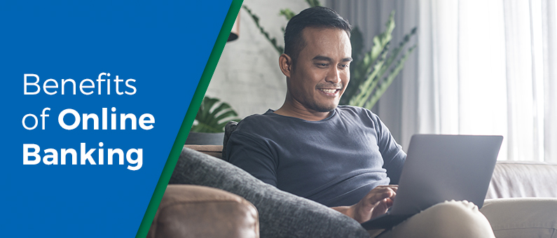 Benefits of Online Banking - Man sittiong on the couch using a laptop