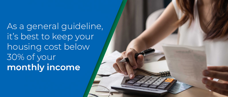As a general guideline, it's best to keep your housing cost below 30% of your monthly income - Person using a calculator