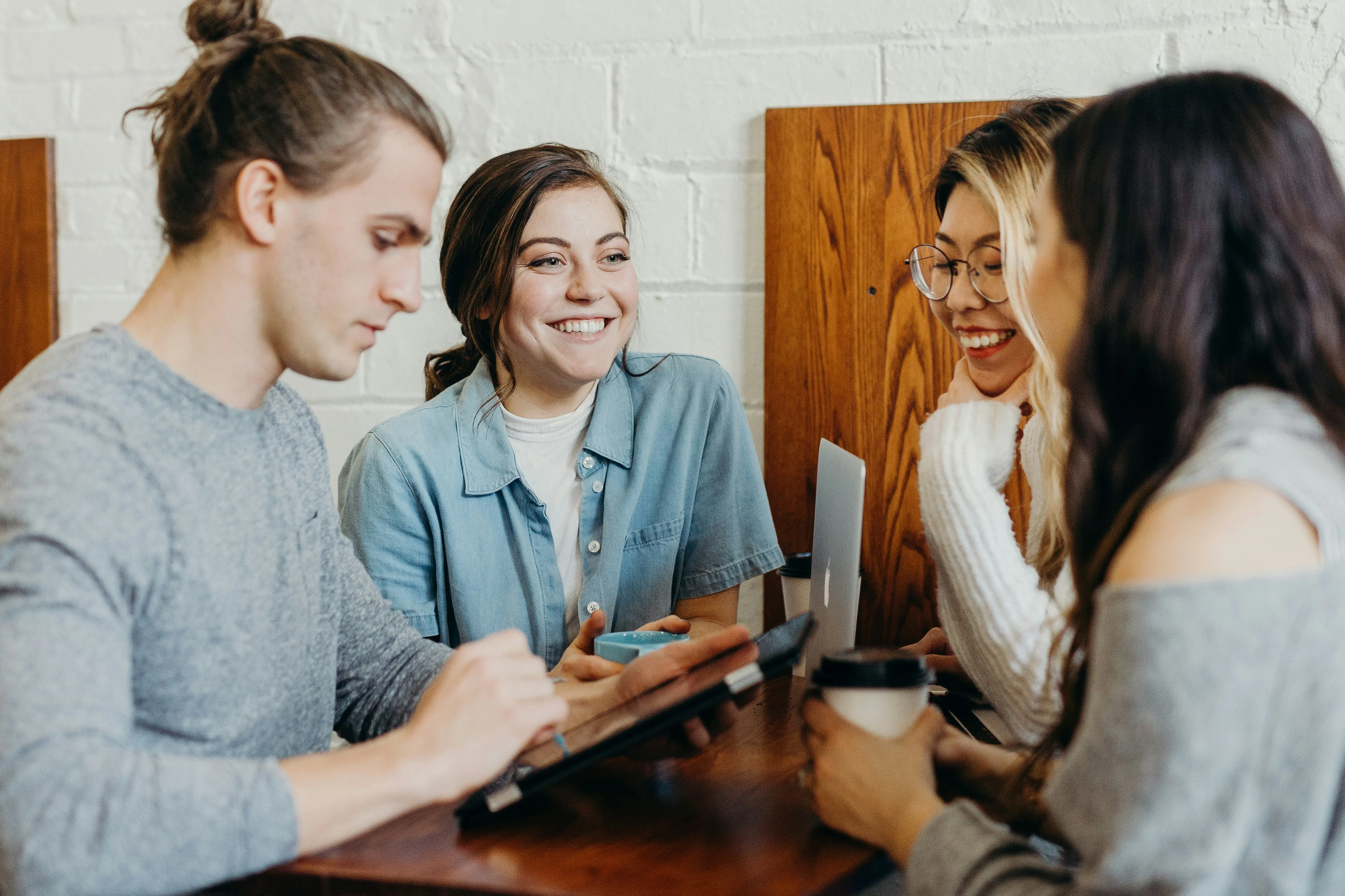 four friends-members of a New York credit union-enjoying coffee together